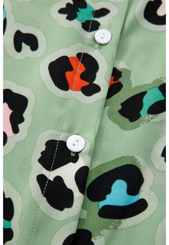 Green Leopard Print Short Sleeve Shirt and Wide Leg Pants Set
  Coordinated two
  piece set with mix
  and
  match possibilities
  Trendy leopard print for a bold and stylish touch
  Short sleeve shirt keeps you cool and chic
  Wide leg pants offer a trendy and flattering silhouette
Material: 100% Polyester