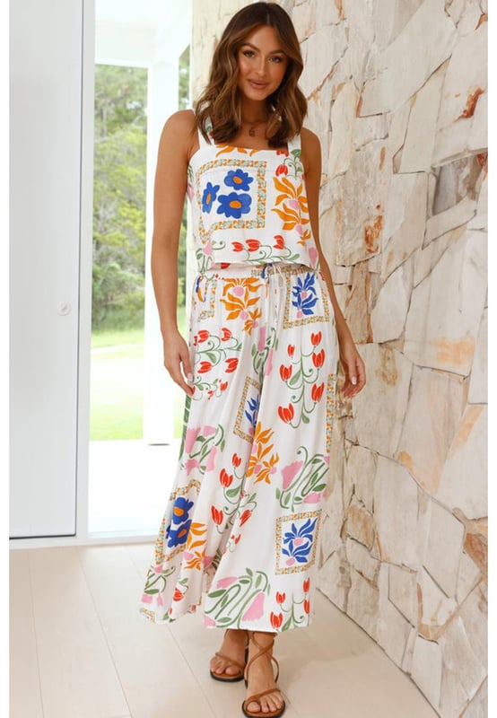 Our styles are designed with a trendy fitted look in mind following an international size standard. For the best fit we suggest choosing one size up from your usual. Be sure to check our sizing chart to find your perfect match!
  White Colorful Printed Square Neck Tank and Wide Leg Pants Set
  Square
  neck tank with wide straps
  Wide
  leg pants for a flowy silhouette
  Feminine floral design
  Soft comfortable fabric for all
  day wear
Material: 100% Viscose
