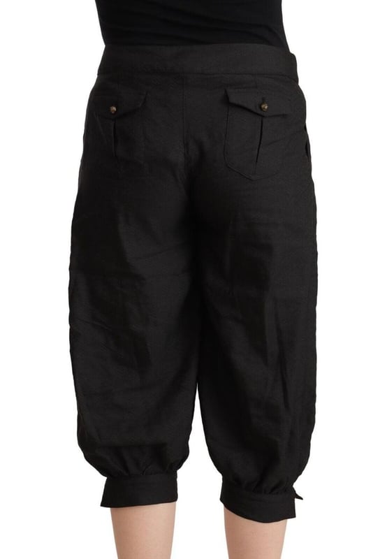 Merk: GF FERRE
  Model: Cropped harembroek
  Kleur: Zwart
  Rits
  en knoopsluiting
  Details van het logo
  Vervaardigd in Italie
  Materiaal: 48% Viscose 35% Polyester 12% Scheerwol 5% Metaal