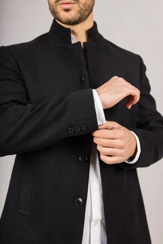 Elevate your outerwear with this refined wool blend overcoat, designed for both style and functionality. Crafted from a premium wool blend, it offers reliable warmth and durability—perfect for colder months. The sophisticated Nehru collar introduces a modern twist to classic tailoring, while the tailored fit ensures a sharp silhouette without sacrificing comfort. Finished with a discreet button closure, this coat delivers a clean, minimalist aesthetic suitable for formal and smart-casual ensembles alike.
Wool Blend Fabric: Made from 85% wool and 15% polyester for warmth, structure, and long-lasting wear.
Sophisticated Nehru Collar: Adds a distinctive and polished touch to any outfit.
Tailored Fit Design: Enhances your silhouette while maintaining comfortable movement.
Discreet Button Closure: Offers a clean, streamlined look with hidden front buttons.
Material Composition: 85% Wool, 15% Polyester.