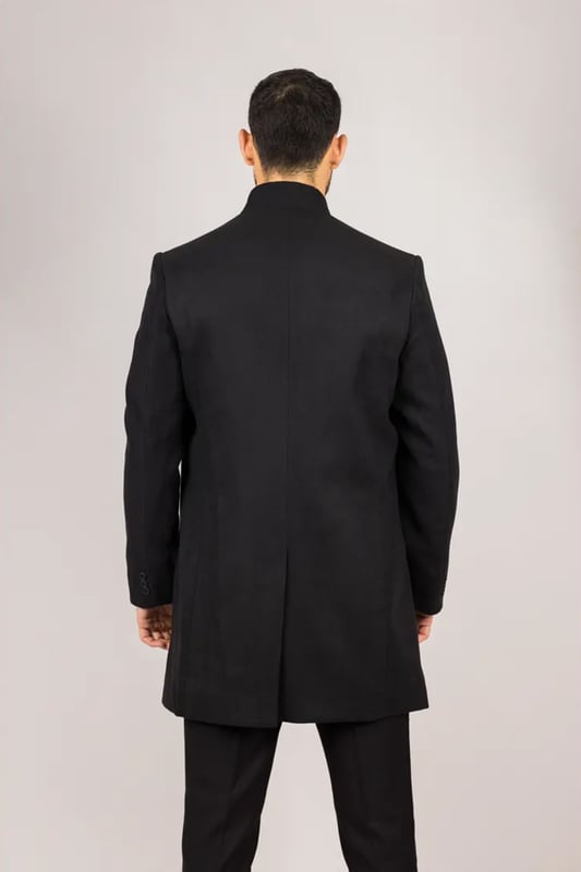 Elevate your outerwear with this refined wool blend overcoat, designed for both style and functionality. Crafted from a premium wool blend, it offers reliable warmth and durability—perfect for colder months. The sophisticated Nehru collar introduces a modern twist to classic tailoring, while the tailored fit ensures a sharp silhouette without sacrificing comfort. Finished with a discreet button closure, this coat delivers a clean, minimalist aesthetic suitable for formal and smart-casual ensembles alike.
Wool Blend Fabric: Made from 85% wool and 15% polyester for warmth, structure, and long-lasting wear.
Sophisticated Nehru Collar: Adds a distinctive and polished touch to any outfit.
Tailored Fit Design: Enhances your silhouette while maintaining comfortable movement.
Discreet Button Closure: Offers a clean, streamlined look with hidden front buttons.
Material Composition: 85% Wool, 15% Polyester.