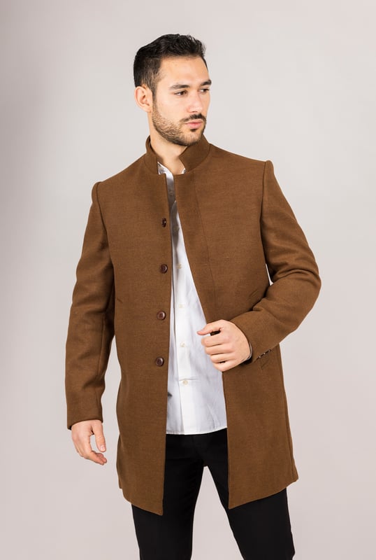 Elevate your outerwear with this refined wool blend overcoat, designed for both style and functionality. Crafted from a premium wool blend, it offers reliable warmth and durability—perfect for colder months. The sophisticated Nehru collar introduces a modern twist to classic tailoring, while the tailored fit ensures a sharp silhouette without sacrificing comfort. Finished with a discreet button closure, this coat delivers a clean, minimalist aesthetic suitable for formal and smart-casual ensembles alike.
Wool Blend Fabric: Made from 85% wool and 15% polyester for warmth, structure, and long-lasting wear.
Sophisticated Nehru Collar: Adds a distinctive and polished touch to any outfit.
Tailored Fit Design: Enhances your silhouette while maintaining comfortable movement.
Discreet Button Closure: Offers a clean, streamlined look with hidden front buttons.
Material Composition: 85% Wool, 15% Polyester.