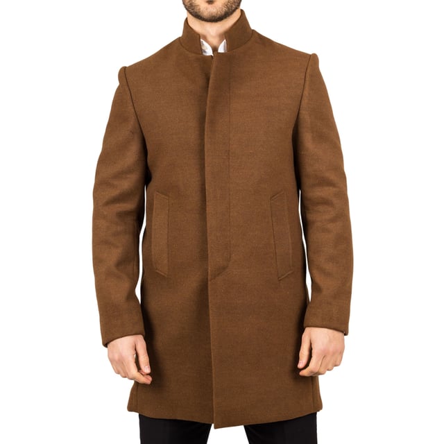 Elevate your outerwear with this refined wool blend overcoat, designed for both style and functionality. Crafted from a premium wool blend, it offers reliable warmth and durability—perfect for colder months. The sophisticated Nehru collar introduces a modern twist to classic tailoring, while the tailored fit ensures a sharp silhouette without sacrificing comfort. Finished with a discreet button closure, this coat delivers a clean, minimalist aesthetic suitable for formal and smart-casual ensembles alike.
Wool Blend Fabric: Made from 85% wool and 15% polyester for warmth, structure, and long-lasting wear.
Sophisticated Nehru Collar: Adds a distinctive and polished touch to any outfit.
Tailored Fit Design: Enhances your silhouette while maintaining comfortable movement.
Discreet Button Closure: Offers a clean, streamlined look with hidden front buttons.
Material Composition: 85% Wool, 15% Polyester.