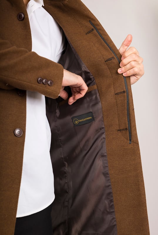 Elevate your outerwear with this refined wool blend overcoat, designed for both style and functionality. Crafted from a premium wool blend, it offers reliable warmth and durability—perfect for colder months. The sophisticated Nehru collar introduces a modern twist to classic tailoring, while the tailored fit ensures a sharp silhouette without sacrificing comfort. Finished with a discreet button closure, this coat delivers a clean, minimalist aesthetic suitable for formal and smart-casual ensembles alike.
Wool Blend Fabric: Made from 85% wool and 15% polyester for warmth, structure, and long-lasting wear.
Sophisticated Nehru Collar: Adds a distinctive and polished touch to any outfit.
Tailored Fit Design: Enhances your silhouette while maintaining comfortable movement.
Discreet Button Closure: Offers a clean, streamlined look with hidden front buttons.
Material Composition: 85% Wool, 15% Polyester.