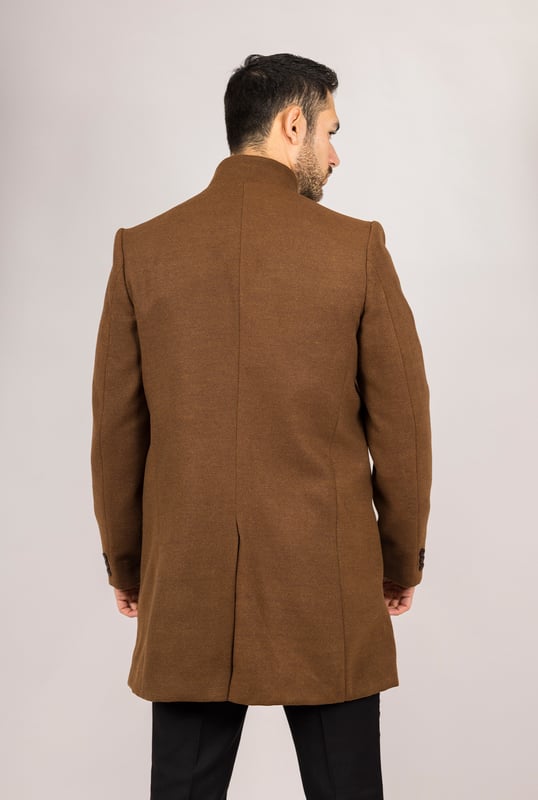 Elevate your outerwear with this refined wool blend overcoat, designed for both style and functionality. Crafted from a premium wool blend, it offers reliable warmth and durability—perfect for colder months. The sophisticated Nehru collar introduces a modern twist to classic tailoring, while the tailored fit ensures a sharp silhouette without sacrificing comfort. Finished with a discreet button closure, this coat delivers a clean, minimalist aesthetic suitable for formal and smart-casual ensembles alike.
Wool Blend Fabric: Made from 85% wool and 15% polyester for warmth, structure, and long-lasting wear.
Sophisticated Nehru Collar: Adds a distinctive and polished touch to any outfit.
Tailored Fit Design: Enhances your silhouette while maintaining comfortable movement.
Discreet Button Closure: Offers a clean, streamlined look with hidden front buttons.
Material Composition: 85% Wool, 15% Polyester.