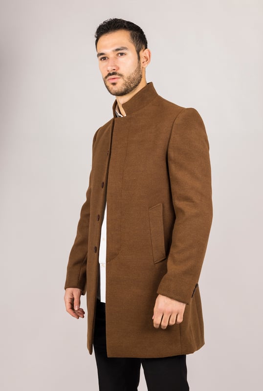 Elevate your outerwear with this refined wool blend overcoat, designed for both style and functionality. Crafted from a premium wool blend, it offers reliable warmth and durability—perfect for colder months. The sophisticated Nehru collar introduces a modern twist to classic tailoring, while the tailored fit ensures a sharp silhouette without sacrificing comfort. Finished with a discreet button closure, this coat delivers a clean, minimalist aesthetic suitable for formal and smart-casual ensembles alike.
Wool Blend Fabric: Made from 85% wool and 15% polyester for warmth, structure, and long-lasting wear.
Sophisticated Nehru Collar: Adds a distinctive and polished touch to any outfit.
Tailored Fit Design: Enhances your silhouette while maintaining comfortable movement.
Discreet Button Closure: Offers a clean, streamlined look with hidden front buttons.
Material Composition: 85% Wool, 15% Polyester.