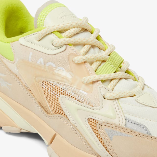 Women's Lacoste L003 Neo Tech Sneakers- Premium mixed upper including canvas  nylon  leather and mesh- Heel lacing detail inspired by the original L003- Lacoste Active branding printed on centre panel- Textured  robust  high-grip rubber outsole- Signature crocodile printed on tongue and heel counter- Ref: 48SFA00876H3