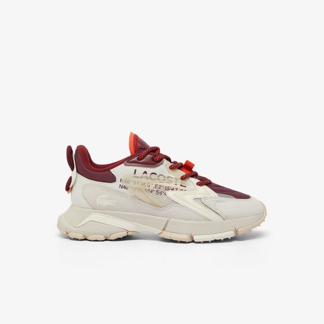 Women's Lacoste L003 Neo Tech Sneakers- Premium mixed upper including canvas  nylon  leather and mesh- Heel lacing detail inspired by the original L003- Lacoste Active branding printed on centre panel- Textured  robust  high-grip rubber outsole- Signature crocodile printed on tongue and heel counter- Ref: 48SFA0087OW9