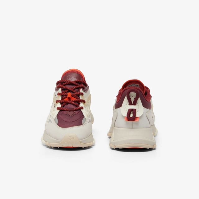 Women's Lacoste L003 Neo Tech Sneakers- Premium mixed upper including canvas  nylon  leather and mesh- Heel lacing detail inspired by the original L003- Lacoste Active branding printed on centre panel- Textured  robust  high-grip rubber outsole- Signature crocodile printed on tongue and heel counter- Ref: 48SFA0087OW9