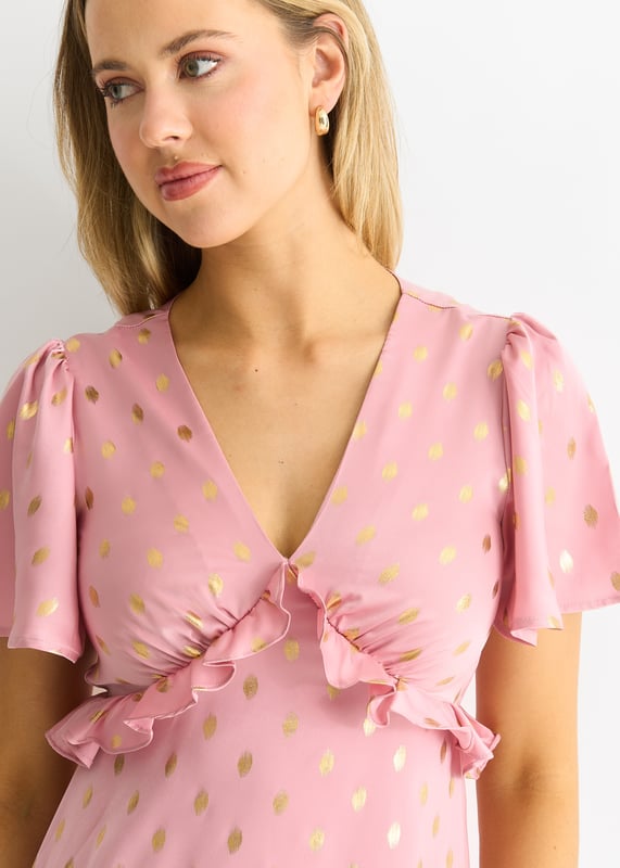 Eleva tu vestuario con este impresionante vestido midi con escote en V en color rubor metalizado. El lujoso color rubor, el favorecedor escote en pico y el llamativo diseño metalizado hacen de este vestido una prenda imprescindible para cualquier ocasión especial. Confeccionado con materiales de alta calidad, este vestido irradia elegancia y sofisticación. Completa tu look con este elegante vestido midi.