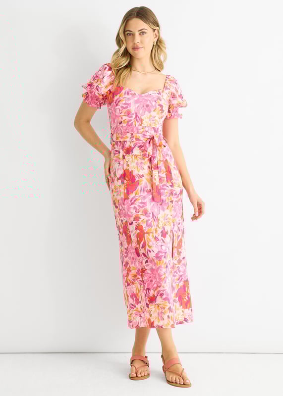 This dress is perfect for any occasion with its red floral design, puff sleeves, and belted waist. The comfortable fit and midi length make it a must-have in your wardrobe. Add a touch of casual elegance to your style with this dress.
