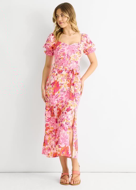 This dress is perfect for any occasion with its red floral design, puff sleeves, and belted waist. The comfortable fit and midi length make it a must-have in your wardrobe. Add a touch of casual elegance to your style with this dress.