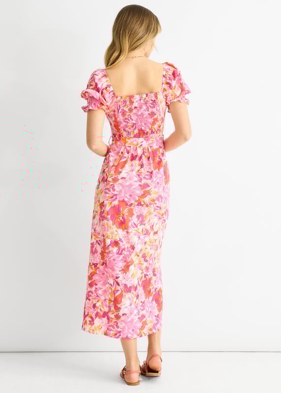 This dress is perfect for any occasion with its red floral design, puff sleeves, and belted waist. The comfortable fit and midi length make it a must-have in your wardrobe. Add a touch of casual elegance to your style with this dress.