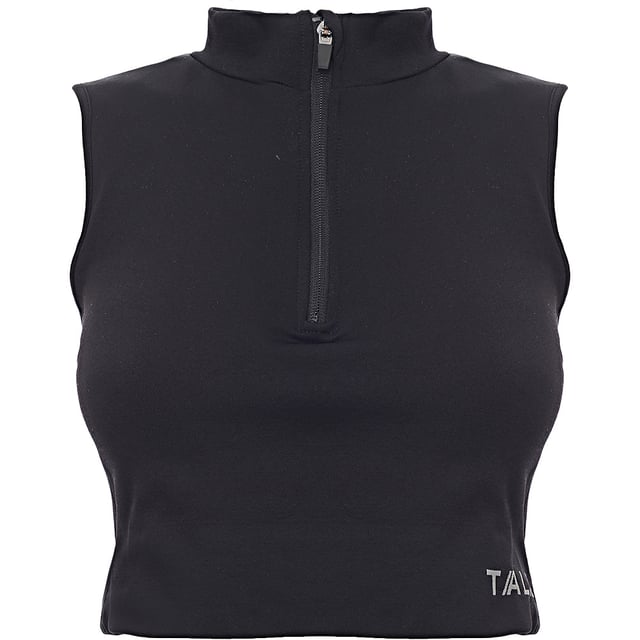 Main: 92% Polyamide, Main: 8% Elastane Upgrade your activewear with the TALA Zahara medium support sports bra with half zip in black. This stylish sports bra offers medium support, making it ideal for a range of activities, from gym workouts to yoga sessions. The half zip design adds a unique and functional touch, allowing for easy on and off while providing a customizable fit. Crafted from a blend of 92% polyamide and 8% elastane, this sports bra ensures excellent stretch and durability, keeping you comfortable and supported throughout your workout. The classic black color makes it a versatile addition to your fitness wardrobe, effortlessly pairing with any activewear.