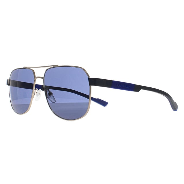 Calvin Klein Aviator Mens Gold Blue CK23103S  Sunglasses is a sharp and angular frame that makes a bold fashion statement. Designed with Calvin Klein's signature aesthetic, it combines clean lines and contemporary styling to create a unique and versatile piece. The frame is lightweight yet sturdy, and its refined construction ensures a secure and comfortable fit, perfect for individuals who prefer an edgier, more fashion-forward look.