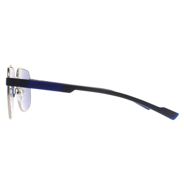 Calvin Klein Aviator Mens Gold Blue CK23103S  Sunglasses is a sharp and angular frame that makes a bold fashion statement. Designed with Calvin Klein's signature aesthetic, it combines clean lines and contemporary styling to create a unique and versatile piece. The frame is lightweight yet sturdy, and its refined construction ensures a secure and comfortable fit, perfect for individuals who prefer an edgier, more fashion-forward look.