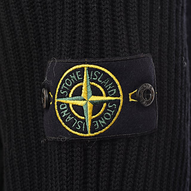 Stone Island Sweaters
       Brand: Stone Island
       Material: 100%Virgin Wool
       Design: Expertly crafted from premium virgin wool, this sweater offers exceptional softness, natural insulation, and breathability. It features ribbed finishes at the neckline, cuffs, and hem for a structured, comfortable fit. The iconic Stone Island compass badge on the sleeve adds a touch of recognizable edge to the minimalist design
       Colour: Black
       Style: Refined and timeless. With a clean silhouette and luxurious feel, this piece transitions effortlessly from casual wear to more elevated stylingâ€”perfect for those who appreciate subtle sophistication and functional design