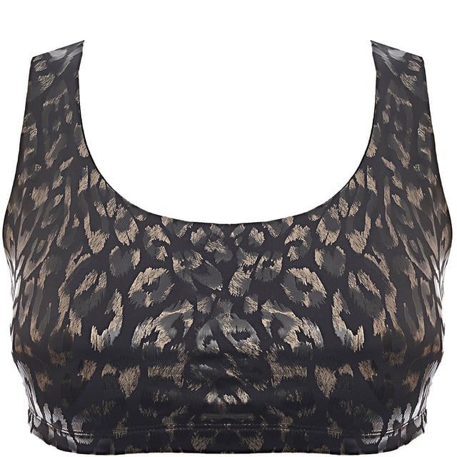 Main: 84% Polyester, Main: 16% Spandex Make a bold statement with the Onzie Mudra Medium Support Sports Bra in a striking metallic animal print. Crafted from a blend of 84% polyester and 16% spandex, this sports bra offers a comfortable and flexible fit. The medium support design is perfect for yoga, pilates, or any moderate-intensity workout, ensuring you stay secure and stylish. The unique metallic animal pattern adds a touch of glamour and edge to your activewear collection, making it a standout piece for any fitness enthusiast. Elevate your workout look with this chic and functional sports bra.
