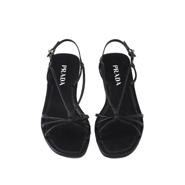 Sandalias Planas de Cuero Prada - Composición: 100% cuero de ternera - Interior: Cuero - Plantilla: Cuero - Suela: Cuero - Punta abierta - Punta cuadrada - Cierre con hebilla ajustable - Plantilla con marca - Logo de triángulo de esmalte - Hecho en Italia - Género: MUJERES -