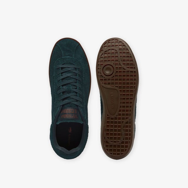 Men's Lacoste Baseshot Suede Trainers in Green Men's Baseshot Suede Sneakers Premium suede upper Padded collar for increased comfort and support Vintage tennis label on tongue Supple high-grip rubber outsole Debossed retro crocodile on front panel