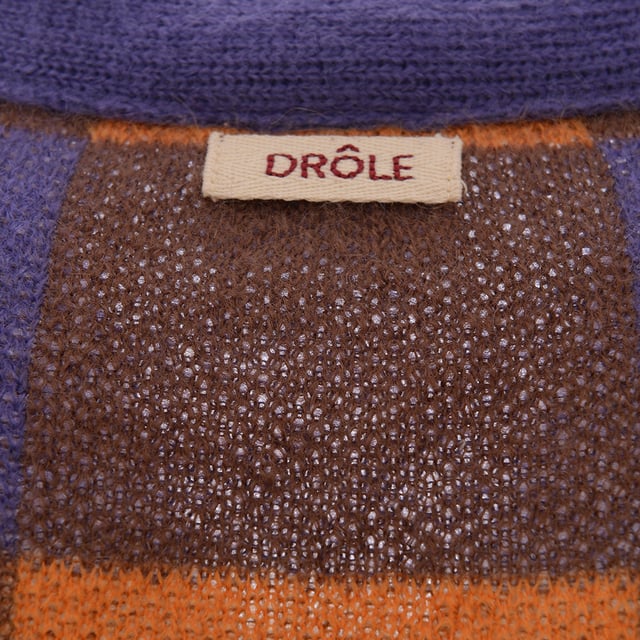 58% SUPERKID MOHAIR 37% PA 5%WO. DrÃ´le de Monsieur continues to remind us that itâ€™s â€œnot from Paris, madameâ€ - while growing our casualwear collection - with this Floral Logo Crew Knit. Epitomising the Dijon labelâ€™s ethos that big opportunities in creative industries like fashion shouldnâ€™t be limited to big capital cities, the slogan takes the limelight here in a fresh floral reboot to take root in any wardrobe.