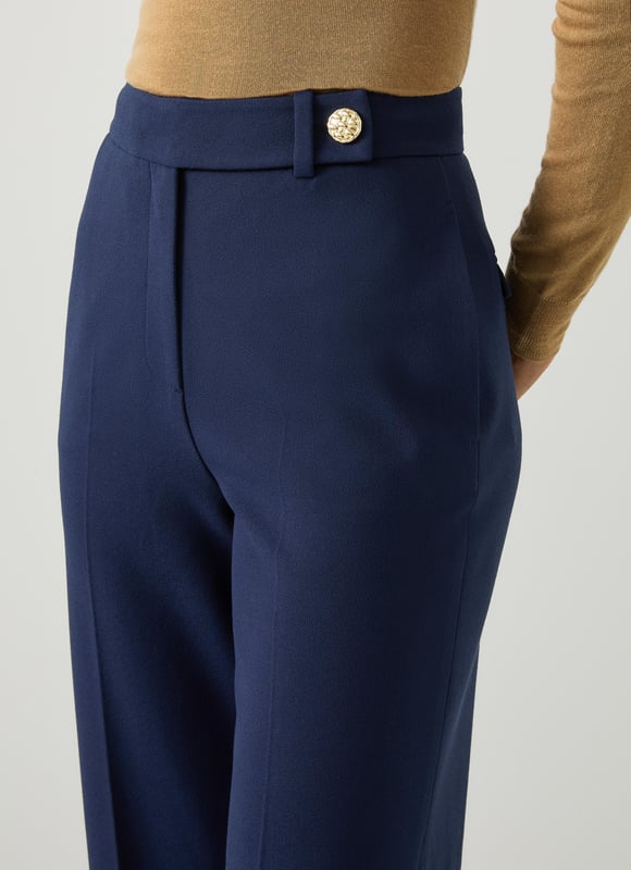 LK Bennett Billie Trousers, Navy Effortlessly step into sophistication with our Billie tailored crop wide trousers. These navy workwear essentials, crafted from a high-quality fabric blend, feature a timeless plain design that exudes elegance. Perfectly pair them with a crisp white blouse or a stylish silk top for a polished look.
