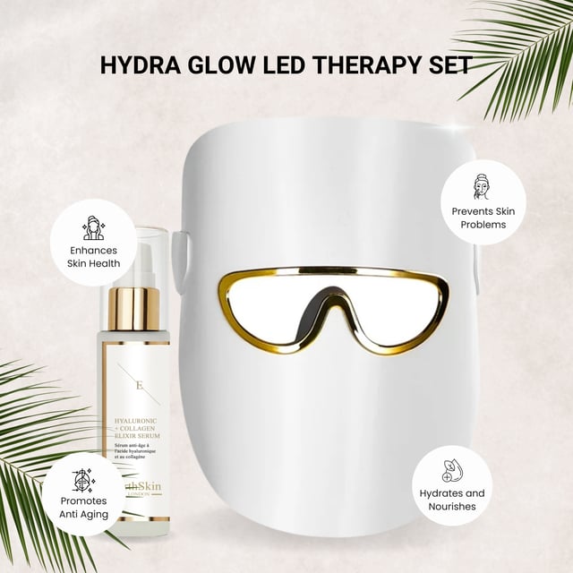 HYDRA GLOW LED THERAPIE SET (LED LICHTTHERAPIE MASKE weiß mit HA Serum) Erleuchte deine Haut mit dem Hydra Glow LED Set, einem kompletten Set, das entwickelt wurde, um zu erfrischen und zu verjüngen. Mit einer weißen LED-Lichttherapie-Maske ausgestattet, nutzt dieses innovative Gerät fortschrittliche Lichttherapie, um die Kollagenproduktion zu fördern, feine Linien zu reduzieren und den natürlichen Glow deiner Haut zu verstärken. Zusammen mit einem nährenden Hyaluronsäure-Serum hydratisiert dieses Set die Haut intensiv und lässt sie prall, weich und strahlend erscheinen. Perfekt für alle Hauttypen, ist das Glow Therapy Kit deine Lösung für einen strahlenden, jugendlichen Teint. Ideal für die tägliche Anwendung, um deine Haut aufzuhellen und zu revitalisieren.