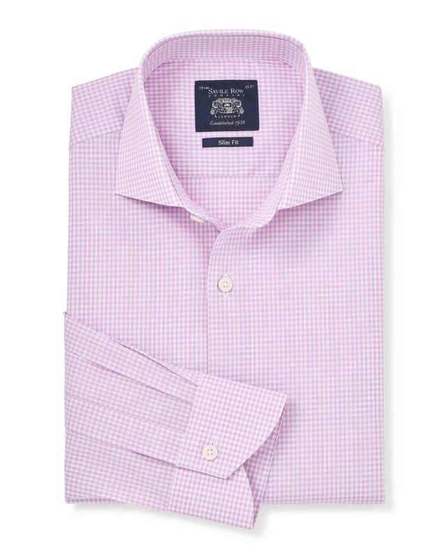 Introducing our bestselling gingham formal shirt in lilac - the perfect addition to your wardrobe for a sophisticated look. Crafted with meticulous attention to detail, this men's shirt offers a sleek silhouette and a timeless design. Slim fit and flattering; gently tapered shape for all builds. Made from 100% BCI cotton poplin and featuers a curl resistant cutaway collar with integral and removable collar stay, and stylish curved edge single cuffs.
