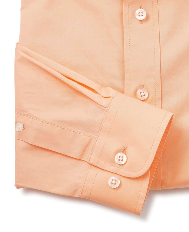 A summer-ready flattering, gently tapered slim fit shirt for men. Peach cotton twill fabric that will soften with each wash, tailored to a flattering fit. This casual shirt has been cut to a shorter length so it can be worn untucked. Featuring a curl resistant cutaway collar, with an integral and removable collar stay and stylish single cuffs. Cut to a flattering, gently tapered fit for all builds.