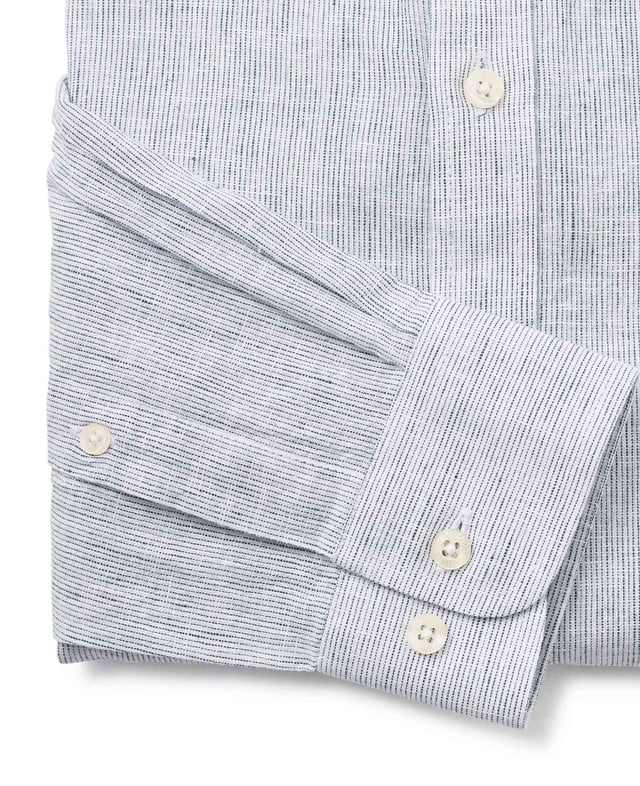 A lightweight 55% linen / 45% cotton blend shirt decorated with white and navy stripes. A smart option for the warmer months. Generously proportioned classic fit with a stylish grandad collar, split yoke, long tails and chest pocket.
