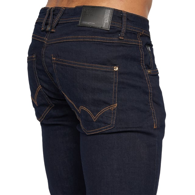99% Cotton, 1% Elastane. Design: Plain. Pockets: 2 Side Pockets, 2 Back Pockets, 1 Coin Pocket. Fastening: Button, Zip Fly. Belt Loops, Branded Buttons, Woven Patch. Fit: Slim.