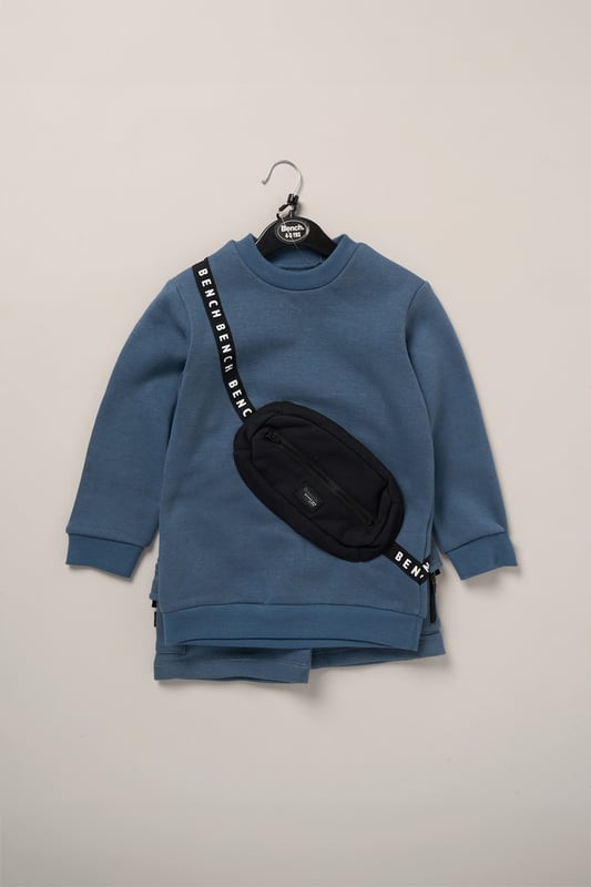 This 2-piece set from Bench includes a standout sweatshirt with a stitched imitation cross body bag detail and matching shorts for a coordinated, streetwear-inspired look. Made from soft brushed sweat fabric and finished with ribbed trims for comfort, it’s an easy go-to for laid-back days. The playful bag detail brings added personality, while the matching shorts complete the look with ease. Perfect for casual wear with a cool, urban edge.