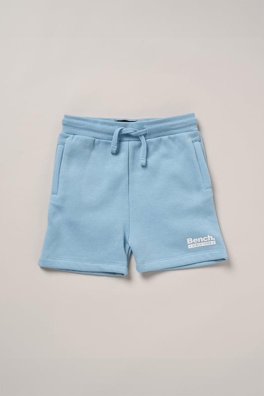 Upgrade everyday style with this easygoing three-piece set from Bench, featuring a classic cotton T-shirt, soft sweat shorts, and a coordinating cotton twill hat. The brushed sweat fabric offers a comfy feel, while ribbed trims and a flat woven drawcord add function and fit. Designed for casual versatility, this outfit set delivers effortless comfort from top to toe.