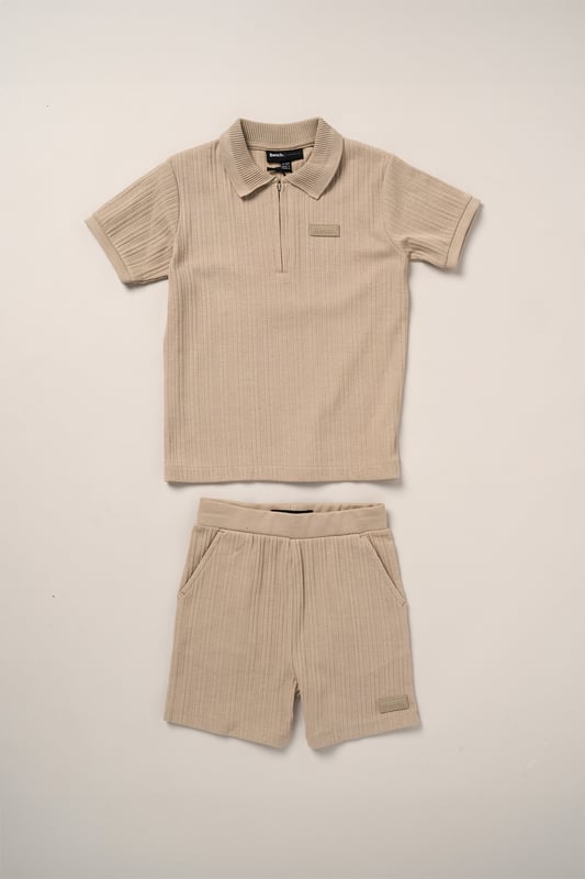 This easy set from Bench includes a ribbed polo shirt and matching shorts made from soft cotton with a bit of stretch for comfort. The ribbed texture gives it a nice finish while still being comfortable to wear. A great choice for everyday wear or casual outings.