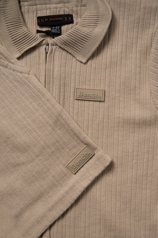 This easy set from Bench includes a ribbed polo shirt and matching shorts made from soft cotton with a bit of stretch for comfort. The ribbed texture gives it a nice finish while still being comfortable to wear. A great choice for everyday wear or casual outings.