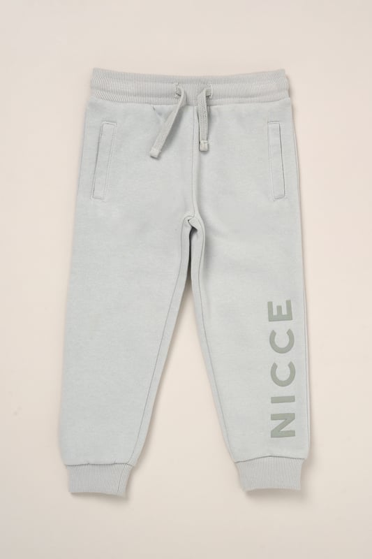 Perfect for play or winding down, this matching hoody and jogger set from Nicce offers soft comfort with a casual edge. Crafted from cosy brushed-back sweat fabric with a self-lined hood and stretchy ribbed details for a snug fit. A flat cotton drawcord adds a functional finish.