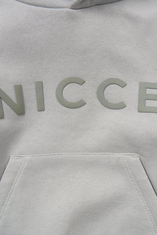 Perfect for play or winding down, this matching hoody and jogger set from Nicce offers soft comfort with a casual edge. Crafted from cosy brushed-back sweat fabric with a self-lined hood and stretchy ribbed details for a snug fit. A flat cotton drawcord adds a functional finish.