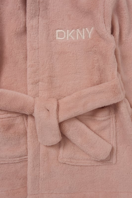 Perfect for after-bath cuddles or lazy mornings, this cosy fleece robe from DKNY is made from soft-touch coral fleece for a gentle feel against baby’s skin. Lightweight yet snuggly, it’s a great extra layer for Spring and Summer evenings at home. Finished with a waist tie for a secure fit.