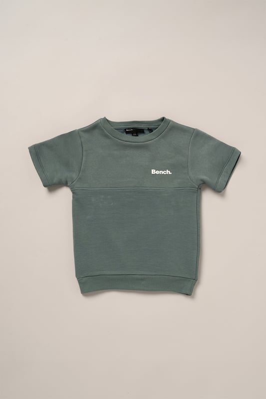 This Bench set combines a short sleeve sweatshirt with matching shorts, made from soft brushed sweat fabric for all-day comfort. Featuring ottoman rib panelling and elasticated rib hems, the outfit blends durability with a premium finish. A flat woven drawcord adds a practical detail, making this set a go-to for casual wear with a stylish edge.