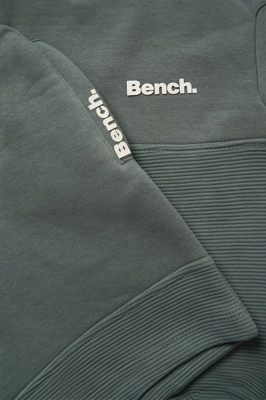 This Bench set combines a short sleeve sweatshirt with matching shorts, made from soft brushed sweat fabric for all-day comfort. Featuring ottoman rib panelling and elasticated rib hems, the outfit blends durability with a premium finish. A flat woven drawcord adds a practical detail, making this set a go-to for casual wear with a stylish edge.