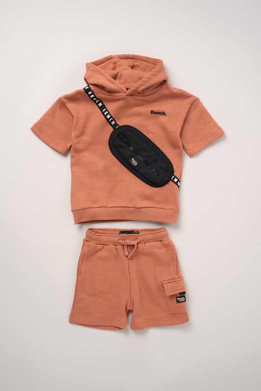 This 2-piece set from Bench includes a standout sweatshirt with a stitched imitation cross body bag detail and matching shorts for a coordinated, streetwear-inspired look. Made from soft brushed sweat fabric and finished with ribbed trims for comfort, it’s an easy go-to for laid-back days. The playful bag detail brings added personality, while the matching shorts complete the look with ease. Perfect for casual wear with a cool, urban edge.