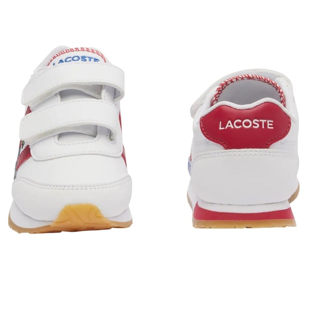 Marke: Lacoste. Obermaterial: Nylon, PU (Polyurethan). Futterstoff: Stoff. Einlegesohle: Mit Markenzeichen. Laufsohle: Gummi. Absatz: Flach. Design: Kontrast Detail, Gesticktes Logo. Zehenstil: Rund. Klettverschluss.