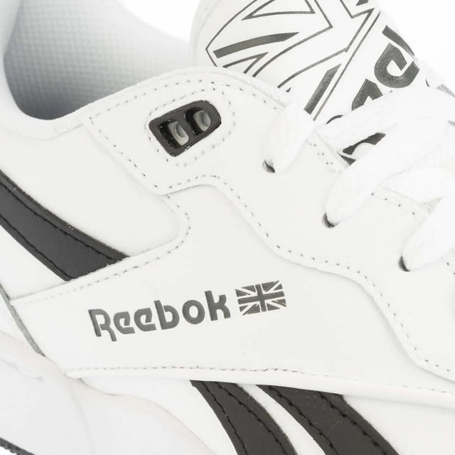 Reebok - Herren/Damen Unisex Sneaker "BB 4000 II", Leder (Weiß/Schwarz) Obermaterial: Leder. Marke: Reebok. Futterstoff: Stoff. Mittelsohle: EVA (Ethyl-Vinylacetat). Laufsohle: Cupsohle, Gummi. Ösen: 5. TPU Ösen. Absatz: Flach. niedrig geschnitten. Design: Logo, Seitenstreifen. Zehenstil: Rund. Zum Schnüren.