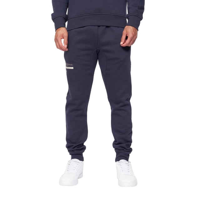 65% Baumwolle, 35% Elastan. Design: Logo. Gewebetechnik: Atmungsaktiv. Taschenart: Zwei Seitentaschen. Taille: mit Kordelzug, Elastisch. Passform: Schmal zulaufend. Saum: Anliegend.