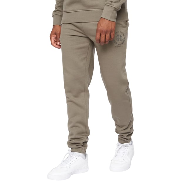 65% Baumwolle, 35% Polyester. Gewebe: angerautes Material. Design: Tintendruck, Logo, Aufschrift. Zum Überziehen. Hi-Build. Taschenart: Zwei Seitentaschen. Taille: Elastisch. Bündchen: Elastisch.