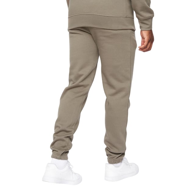 65% Baumwolle, 35% Polyester. Gewebe: angerautes Material. Design: Tintendruck, Logo, Aufschrift. Zum Überziehen. Hi-Build. Taschenart: Zwei Seitentaschen. Taille: Elastisch. Bündchen: Elastisch.