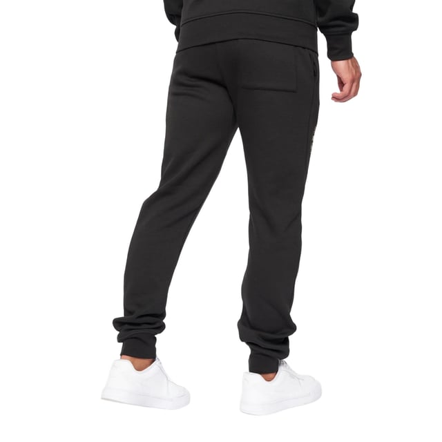 65% Baumwolle, 35% Elastan. Design: Logo. Gewebetechnik: Atmungsaktiv. Taschenart: Zwei Seitentaschen. Taille: mit Kordelzug, Elastisch. Passform: Schmal zulaufend. Saum: Anliegend.