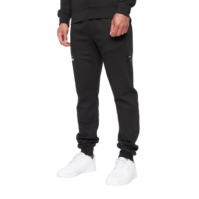 65% Baumwolle, 35% Elastan. Design: Logo. Gewebetechnik: Atmungsaktiv. Taschenart: Zwei Seitentaschen. Taille: mit Kordelzug, Elastisch. Passform: Schmal zulaufend. Saum: Anliegend.