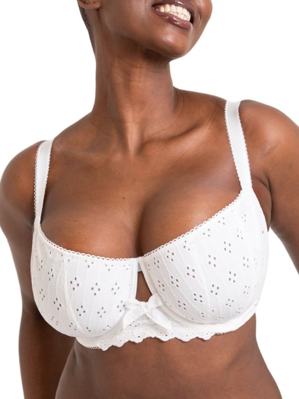 Curvy Kate Flora Balcony Bra. Underwired non padded balcony bra with uplifting vertical seams, broderie anglaise inspired embroidered fabric, cotton trims, scalloped edging and bow detailing. The product is recommended for hand wash only.