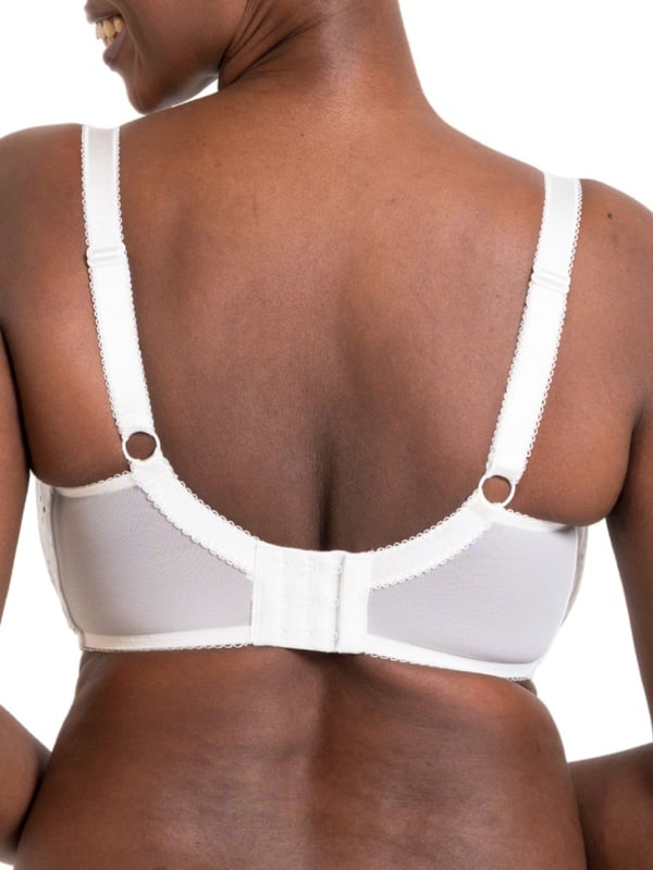 Curvy Kate Flora Balcony Bra. Underwired non padded balcony bra with uplifting vertical seams, broderie anglaise inspired embroidered fabric, cotton trims, scalloped edging and bow detailing. The product is recommended for hand wash only.